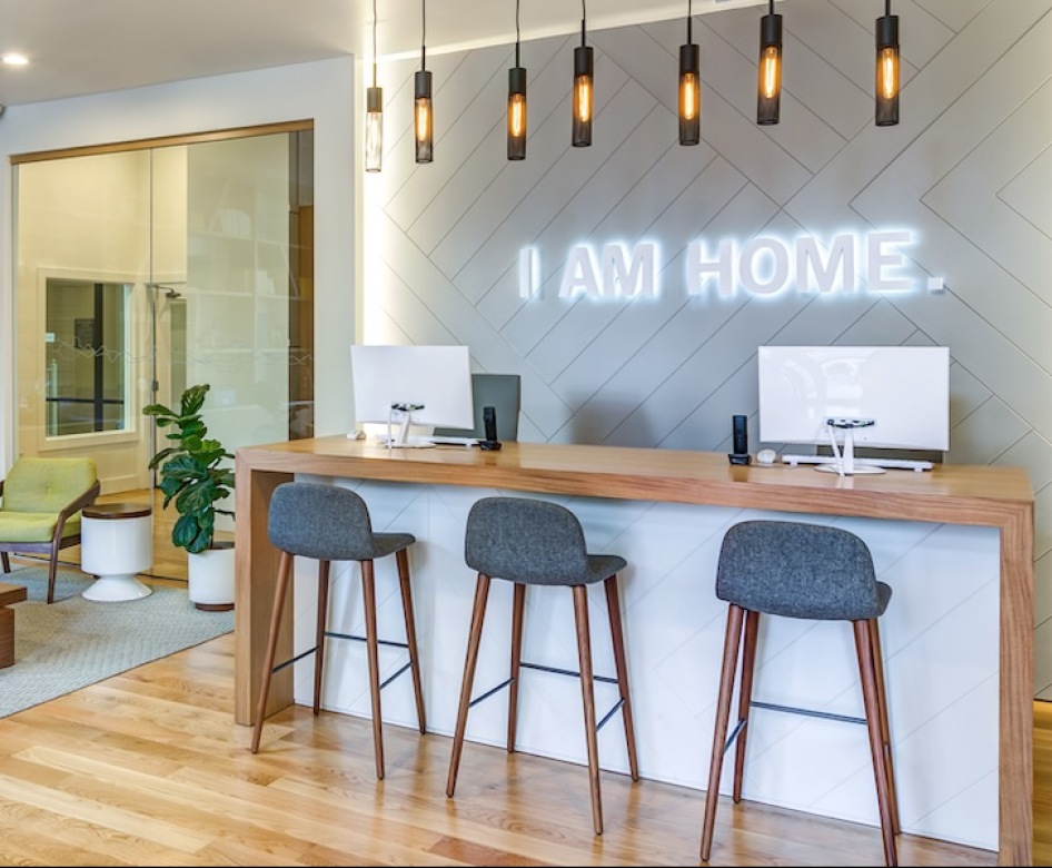 Spacious well lit lounge with bar seating 