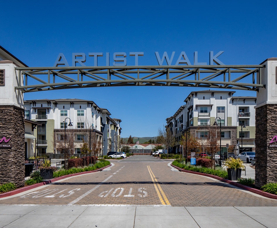 entrance with sign for Artist Walk Apartments